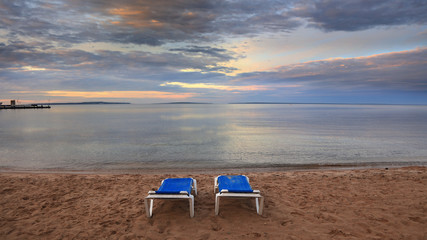 Two beach chairs by Lake Huron