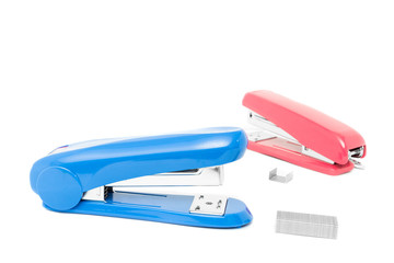 Top view of two stapler with pile of staples isolate on white background.