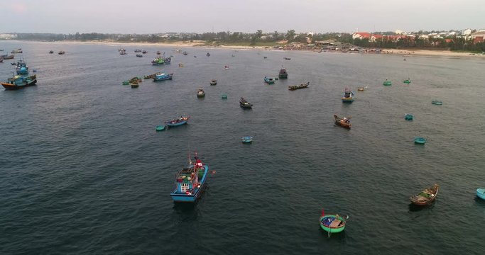 Top view, aerial view from drone. Royalty high quality free stock footage of Mui Ne fishing harbour or fishing village. Mui Ne fishing harbor is a popular tourist destination. Phan Thiet city, Vietnam