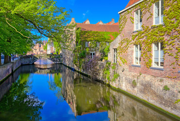 Fototapeta na wymiar The canals of Bruges (Brugge), Belgium on a sunny day.