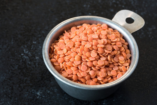 Red Lentils in a Measuring Cup