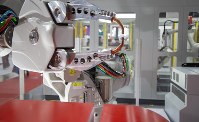 Automated industrial robot spot welding in automotive industry