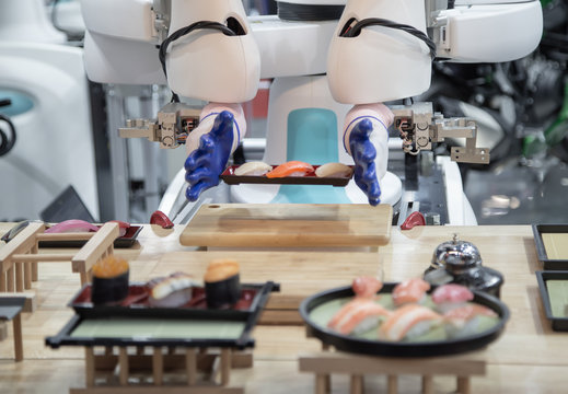 Smart robot preparing Japanese food a dish of sushi