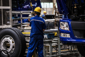 Workers in machinery factory in China.