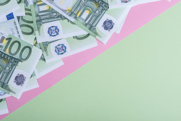 Euro cash on a pink and green background. Euro Money Banknotes. Euro Money. Euro bill. Place for text.