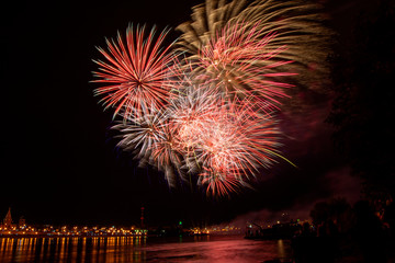 Festive fireworks. Fireworks. A huge firework in the sky. Bright explosions of fireworks. Colored sparks.Fireworks display on dark sky background.Fireworks.Colourful fireworks on the sky