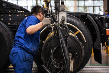 Workers in machinery factory in China.
