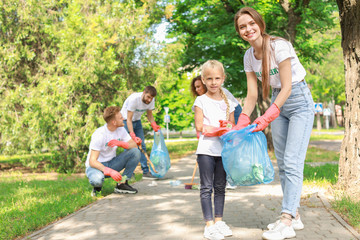 Volunteers gathering garbage in park