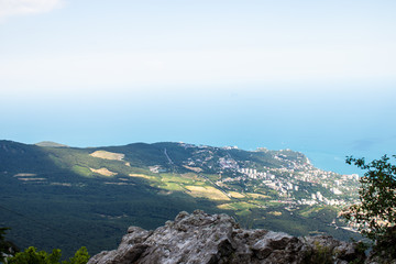 Fototapeta na wymiar Black Sea view from Ai-Petri mountain. Light sunny summer day, Crimea, Yalta, Russia.