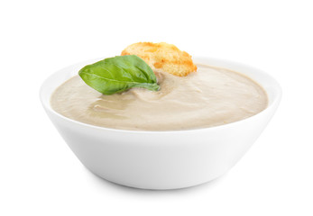 Bowl of tasty cream soup on white background