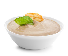 Bowl of tasty cream soup on white background