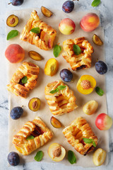 Homemade puff pastry pies with fruit