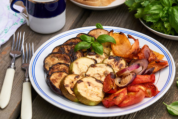Various grilled vegetables on a white plate                              