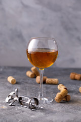 White wine in a glass. The concept of winemaking. Place under your text. Still life on a textural background.