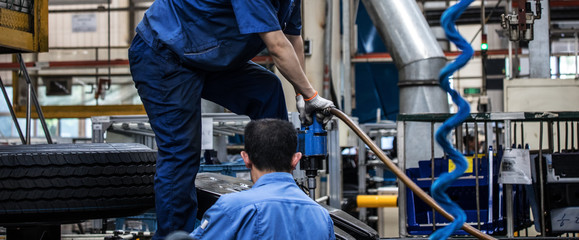 Workers in machinery factory in China.