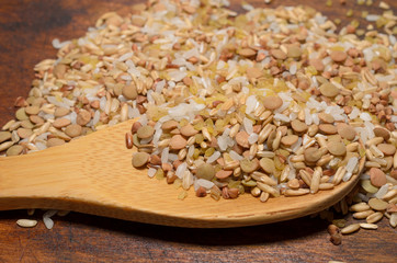 Assortment of various kinds grains in wooden spoon, healthy diet