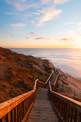 Stair walkway along the coastline with sunset view at Port Noarlunga, South Australia.
