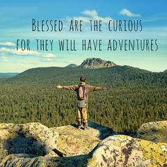 Blessed are the curious for they will have adventures - inspiration quote on natural mountain landscape. picturesque view of mountain and tourist, theme for travel backdrop design card. soft focus © Ju_see