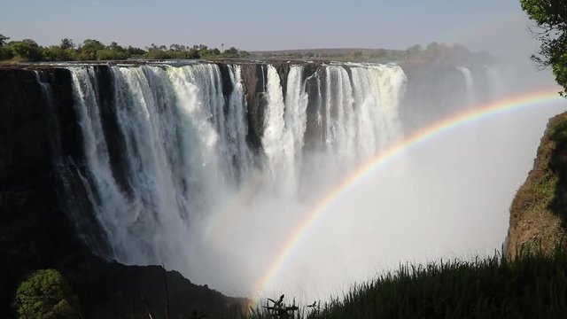 Magnificent Victoria Falls in Simbabwe with rainbox during dry season