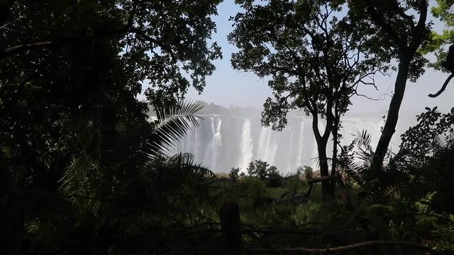 Magnificent Victoria Falls in Simbabwe with rainbox during dry season