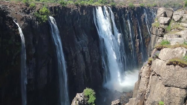Magnificent Victoria Falls in Simbabwe with rainbox during dry season