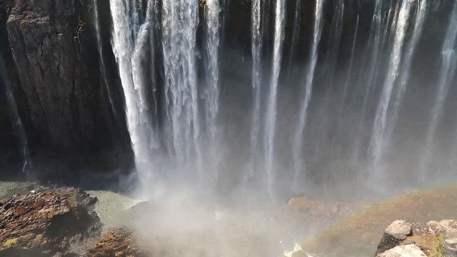 Magnificent Victoria Falls in Simbabwe with rainbox during dry season
