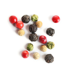 Mixed peppercorns isolated on white, top view