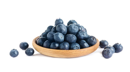 Plate of fresh raw blueberries isolated on white