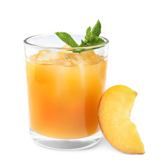 Delicious refreshing peach cocktail in glass and fresh fruit on white background