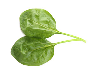 Fresh green healthy baby spinach leaves isolated on white, top view