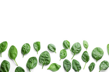 Fresh green healthy baby spinach leaves on white background, top view
