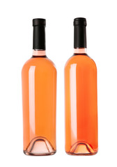 Bottles of delicious rose wine on white background. Mockup for design