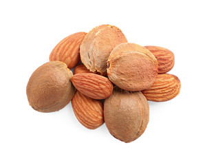 Organic dried apricot kernels on white background