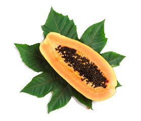 Fresh juicy halved papaya with leaf on white background, top view