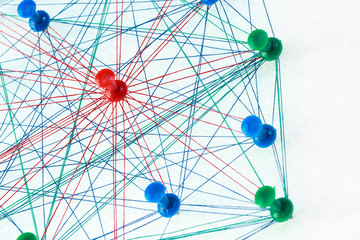 Color needles are connected by a thread, communicate with each other, and each is separately associated with a needle of a different color	
