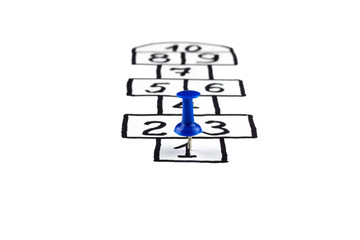 Fototapeta premium hopscotch game, player at the start, the concept of the beginning of a career, the beginning of movement and growth 