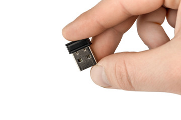 small flash drive in hand close up. Isolate	