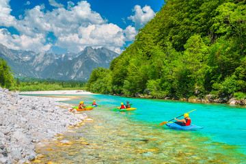 Kayakers on the famous turquoise Soca river, Bovec, Slovenia