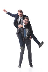 happy businessman carrying his colleague on the piggyback