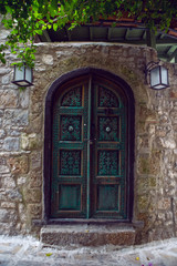 Fototapeta na wymiar old retro green door in old town in Marmaris