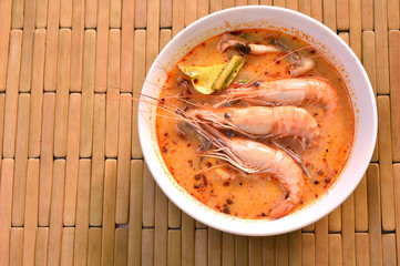 boiled shrimp with herb in Thai spicy soup or tom yum kung on bowl