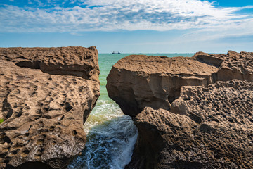 Rocky seashore and storm waves