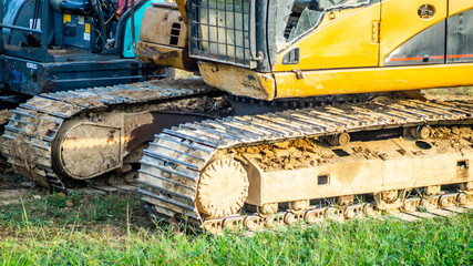 Huge excavator park on construction work site