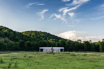 Ranch in the nature with a fence and a barn