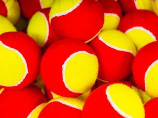 Fototapeta na wymiar many yellow and red tennis balls