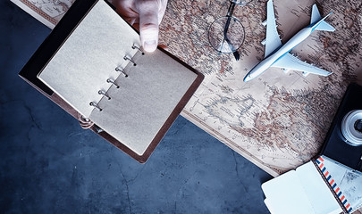 Travel concept. Map on the table andl aircraft.
