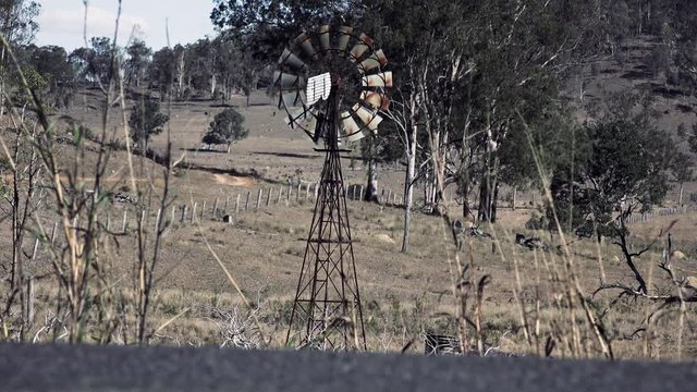 Rustic windmill in the countryside of Queensland, Australia.