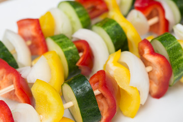 fresh raw vegetables on sticks for grill