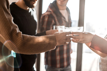 background image of a glass of juice in the hands of the young couple