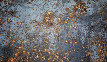 The texture is metallic. Industrial background from an old rusty metal. Textured metal background with rust and cracks.